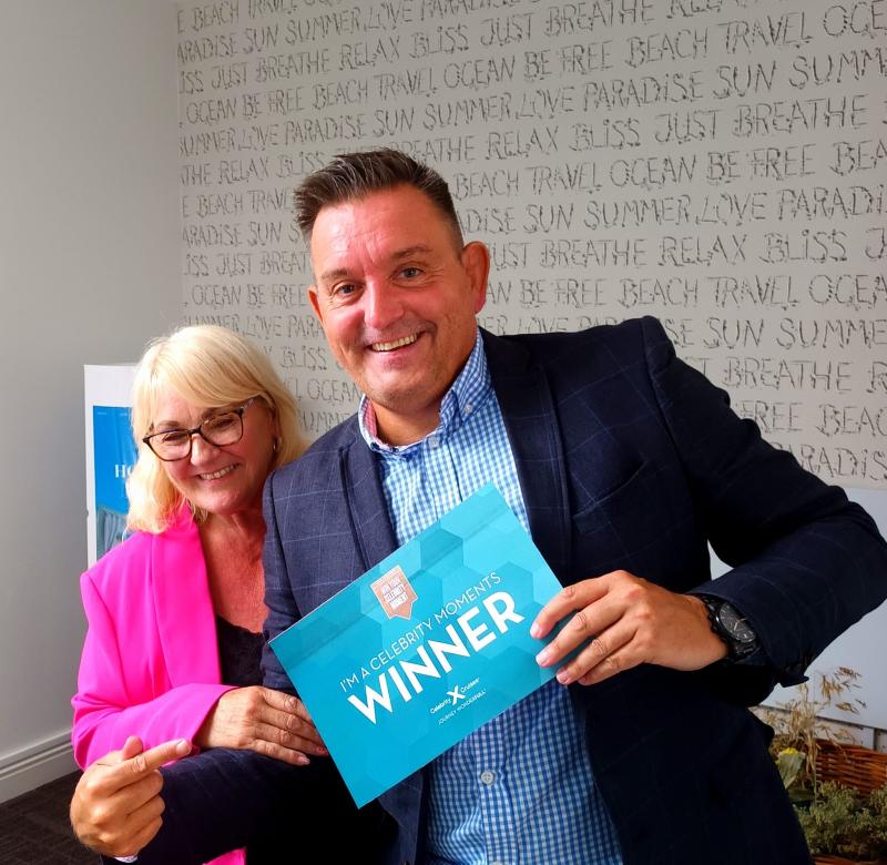Celebrity's Neil Davies went to Cowbridge Travel to deliver a prize