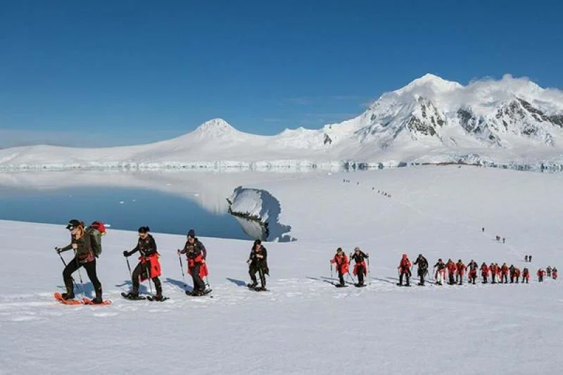 Hurtigruten clients explore Damoy Point in Antarctica. Credit: Espen Mills
