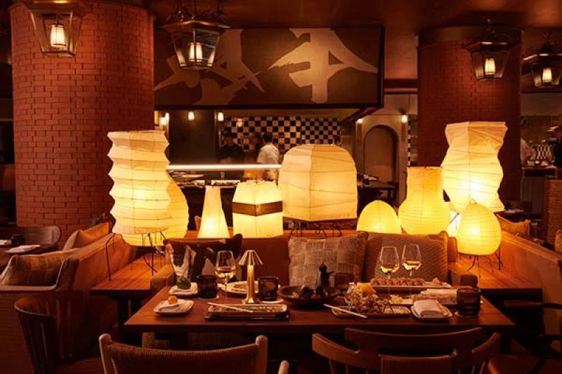The interior of Restaurant Morimoto Bordeaux is punctuated by red Bordeaux brick columns